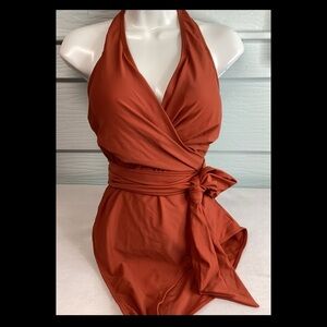 Rust color, one piece, halter top swimsuit.